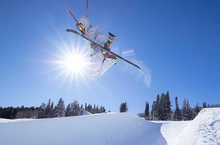 A skier catches big air at Buttermilk