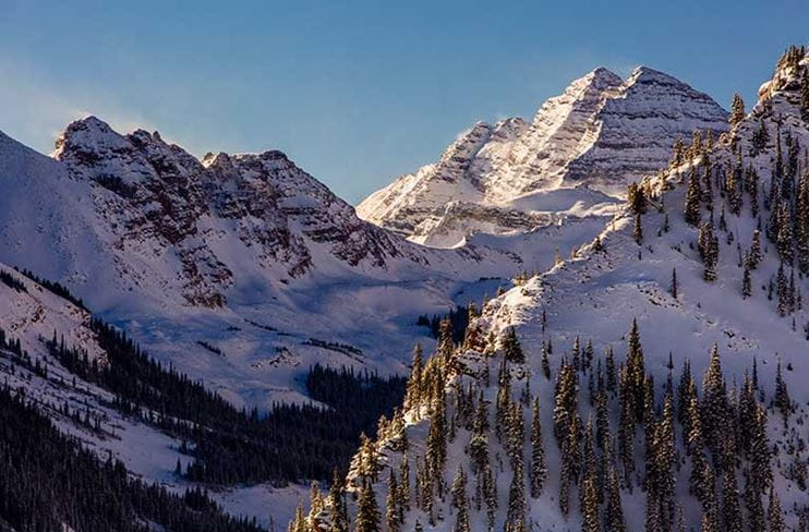 Maroon Bells at sunrise as seen from atop Snowmass