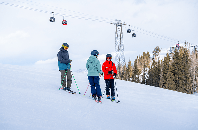 Adult group lesson pauses under Silver Queen gondola 