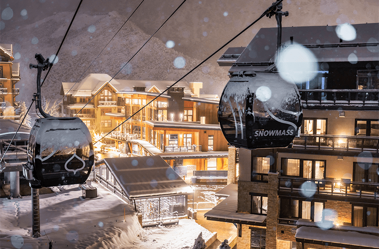 Snowmass Gondola at night in front of Limelight Snowmass