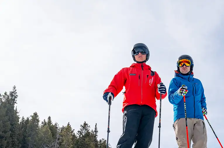 Ski School instructor with student at Aspen Snowmass