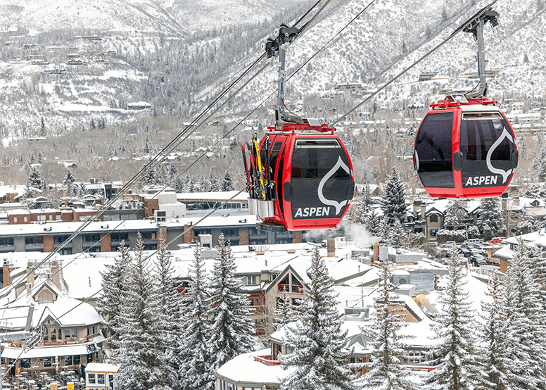 Two red gondola cars on the Silver Queen Gondola in Aspen 