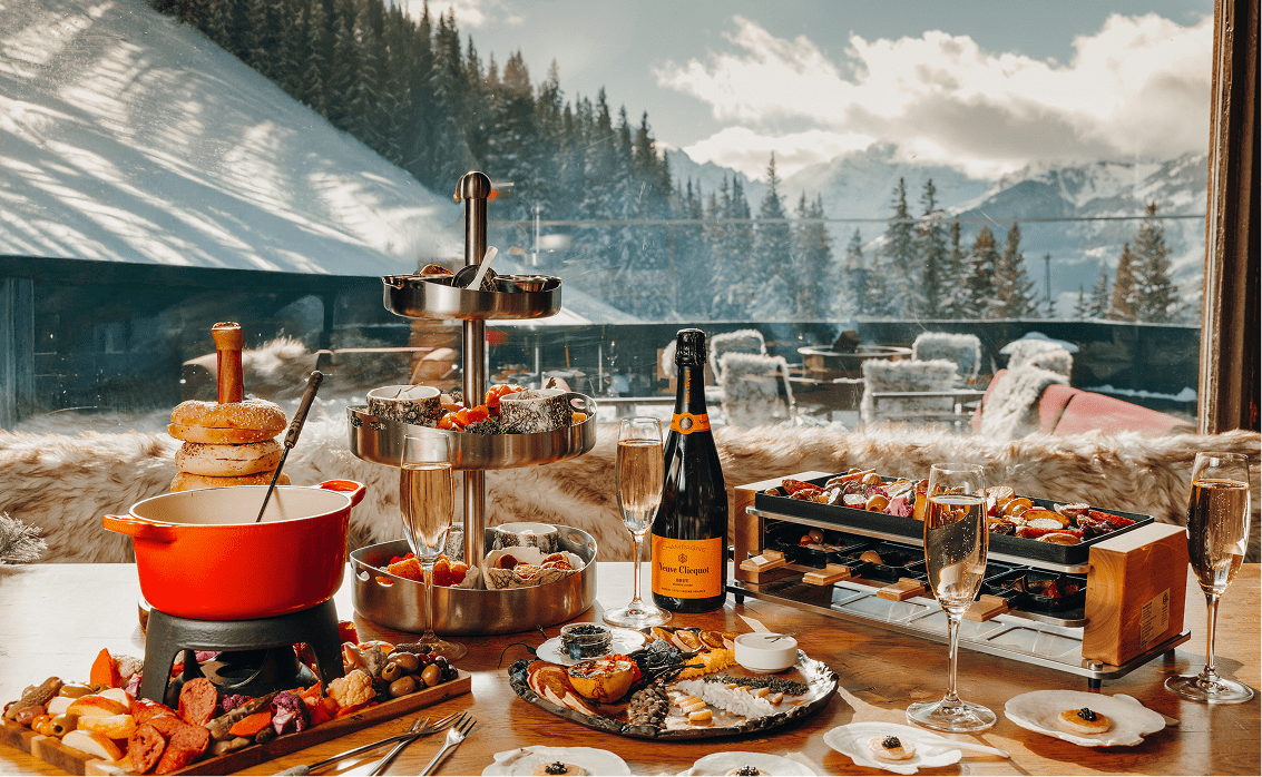 full table spread at Cloud Nine at Aspen Highlands, fondue, champagne, caviar, and other bites 