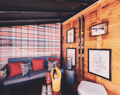 interior view of one of the cabins at Eleven212, cozy furniture and wooden walls