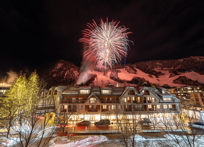 The Little Nell, illuminated by fireworks over the roof during the NYE celebration
