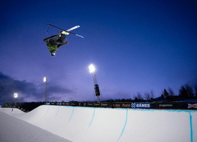 Skier gets air over the half pipe during the X Games