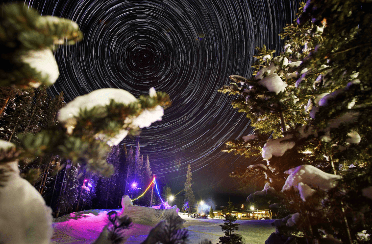starts in the night sky above Ullr Night, christmas lights on the snow 
