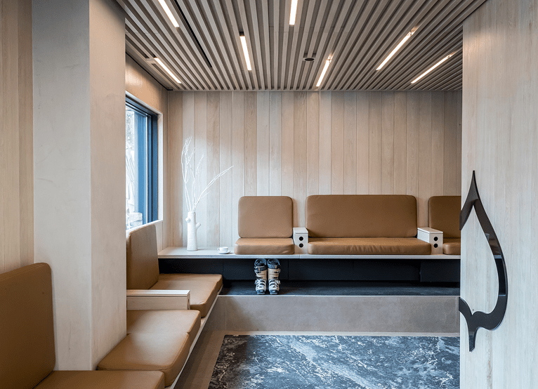 Leather chairs in wood room, at Aspen Collection fitting room to get your ski and snowboard boots for the day