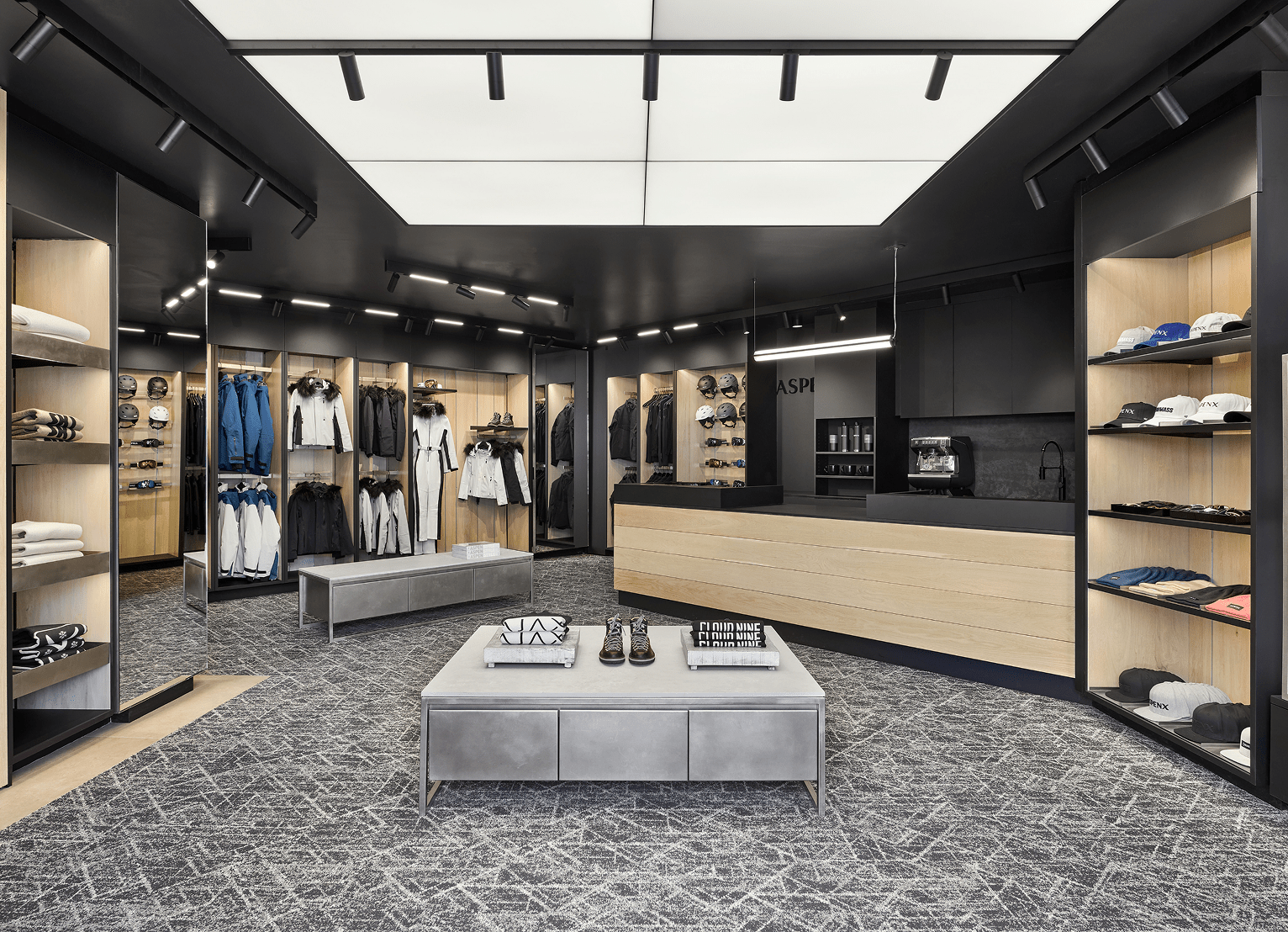 Interior of Aspen Collection, black and light wood in store displaying the products