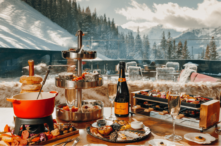 Table scape of decident bites and champagne at cloud nine alpine Bistro in aspen
