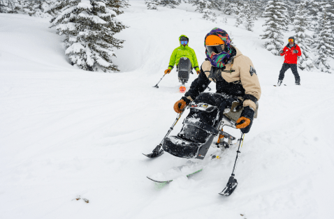 adaptive skier in powder at aspen