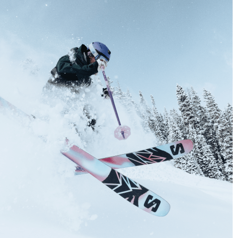 Skier in powder on bluebird day at aspen