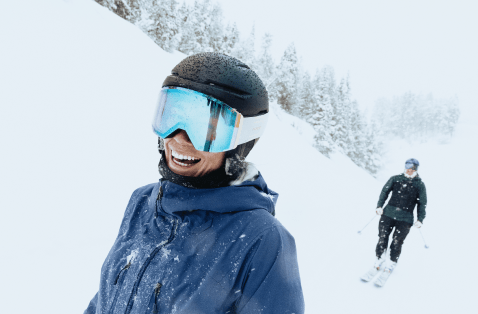 woman smiles on a snowy day at aspen