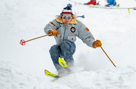 man in jeans and jean jacket skies down bumps