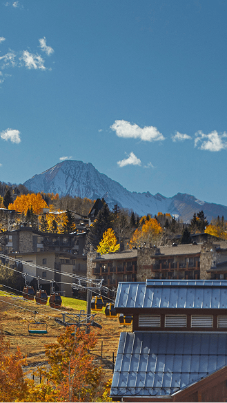 Aspen Mountain in the fall, gondola running past beautiful hotels