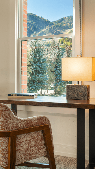 nice chair at desk overlooking mountain scene at limelight aspen