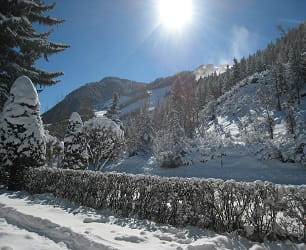 Winter shot from the front of the hotel looking toward Aspen Mountain.