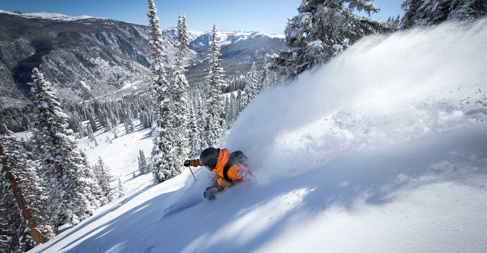 A skier alone in deep powder at Aspen Mountain