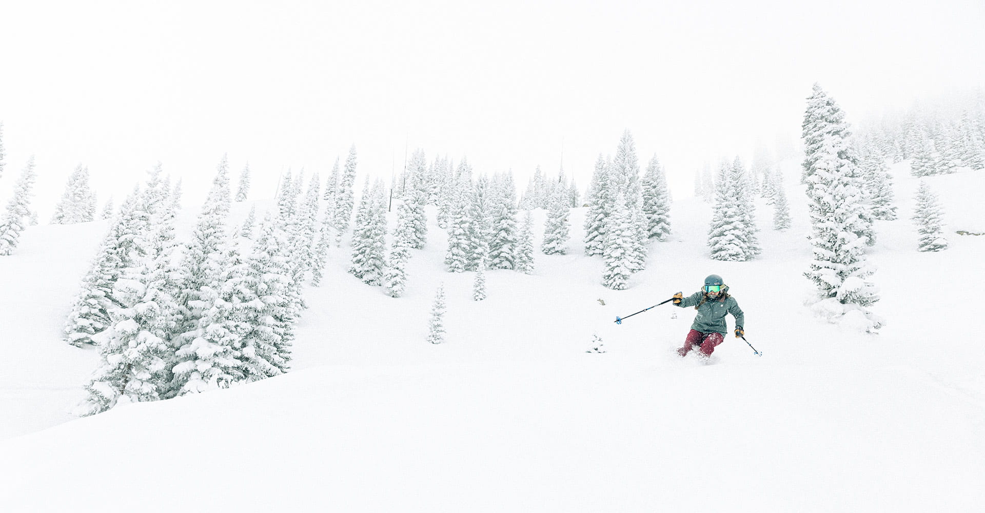 Solo skier on a powder day in the glades of Aspen Snowmass