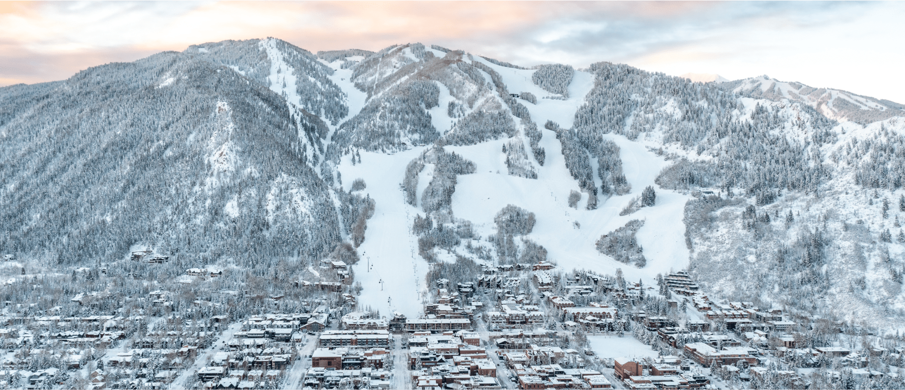 Beautiful sparkly ski town, aspen mountain, at dawn, pink skies over the sleepy town