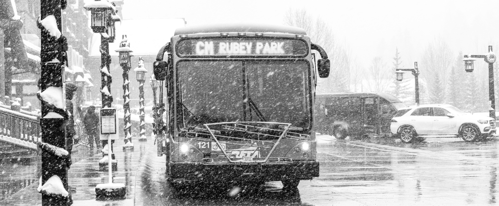 Black and white image of the bus in the town of aspen
