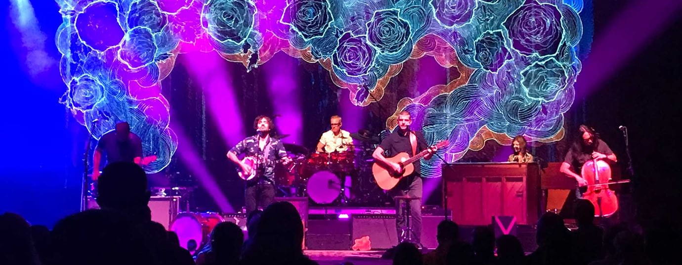 Avett Brothers playing a concert at night. 