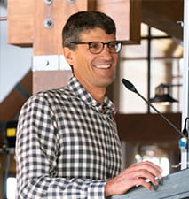 Mike Kaplan speaking at an event in Aspen, Colorado