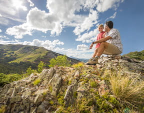 Father and child hiking at Aspen Snowmass during summer.