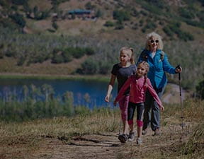 A grandmother hiking with her granddaughters on Snowmass, Colorado